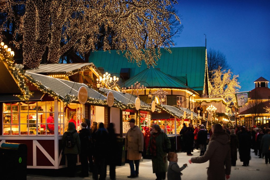 Christmas season at Liseberg with market stalls and decorations.