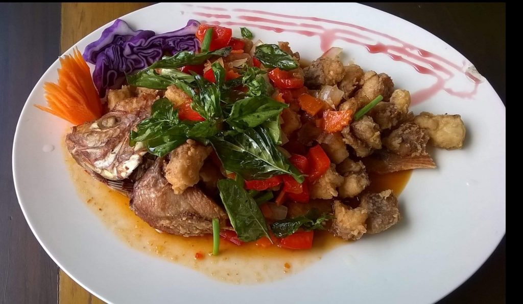 Food memory of a deep fried fish with tamarind sauce in Thailand.