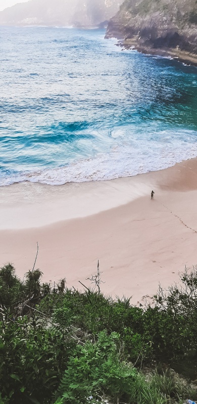 Human standing on the beach.