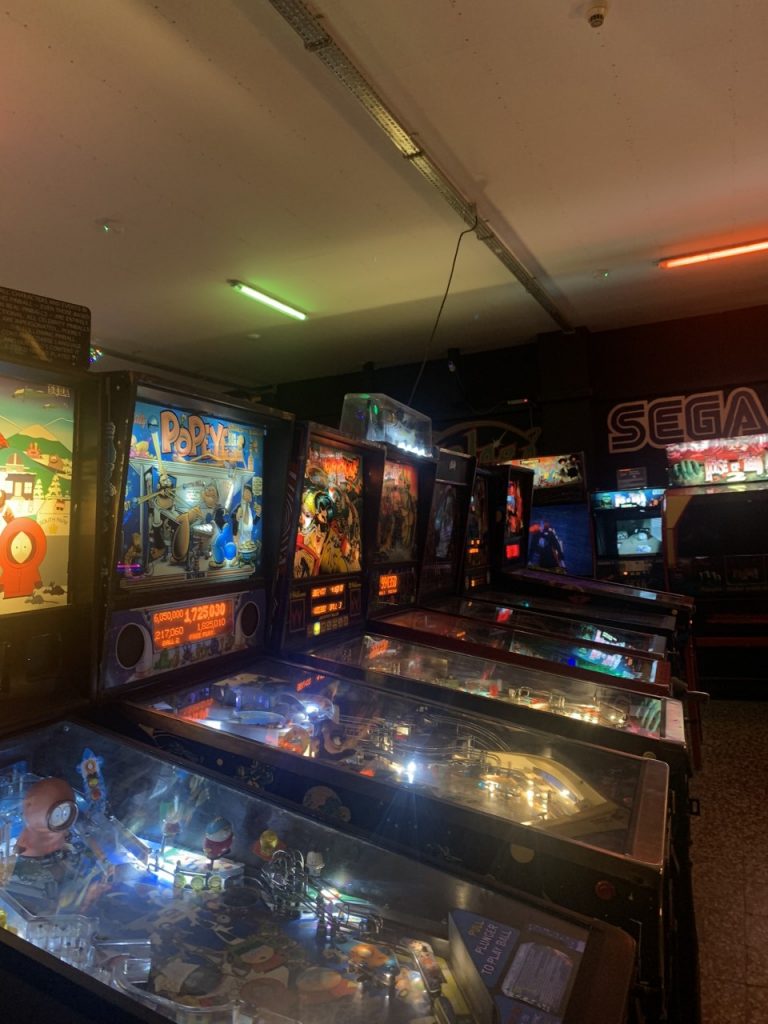 A picture from the Arcade Museum. There is lots of old arcade games in a row.