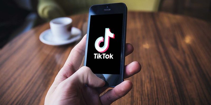 Someone using TikTok in a cafe