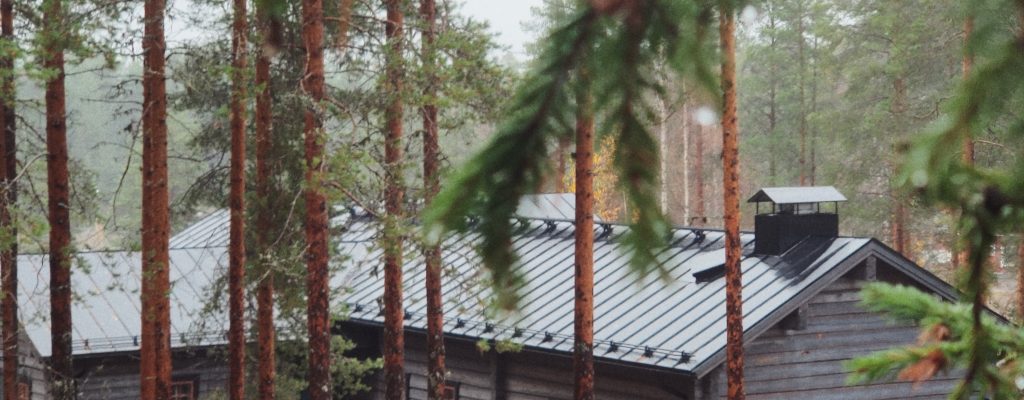 Kalevala village with wooden houses surrounded by nature in Kuhmo.