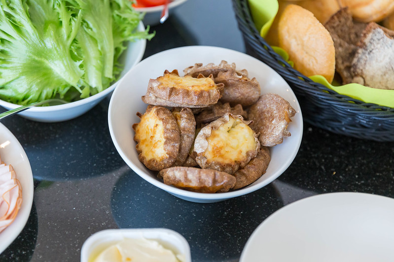 Traditonal Finnish Karelian pies in a bowl on a table.