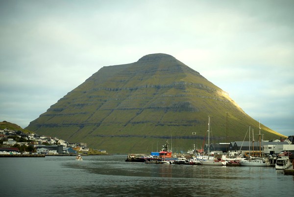 A mountain and a town by a sea gulf..