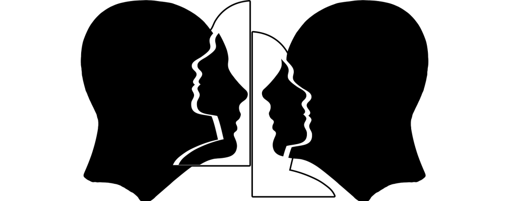 Drawing of two heads of men whose outlines intersect. Graphic representation of emphaty.
